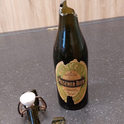 Picture of a broken Heineken® beer bottle from the Heineken Experience exibition.