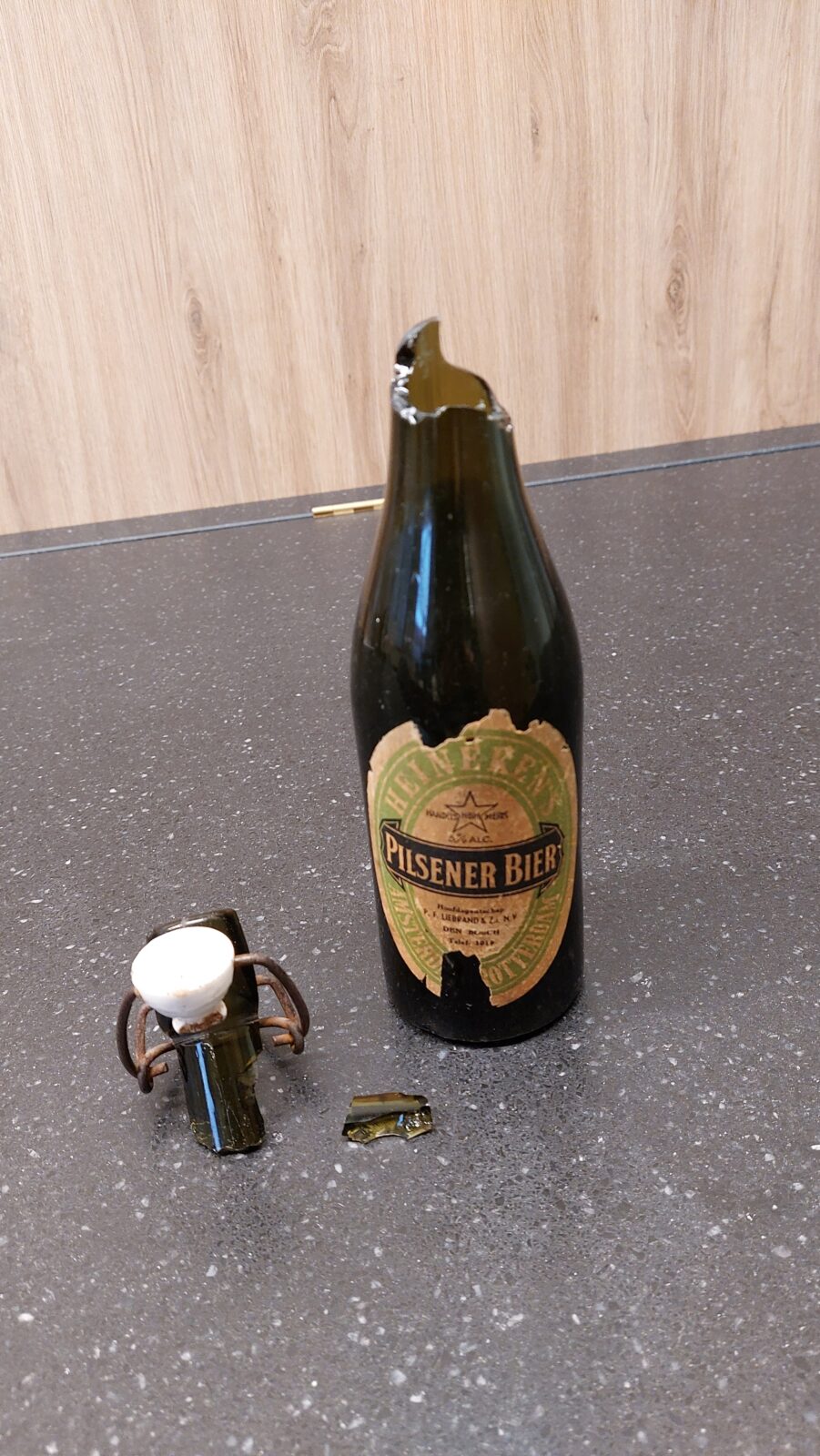 Picture of a broken Heineken® beer bottle from the Heineken Experience exibition.